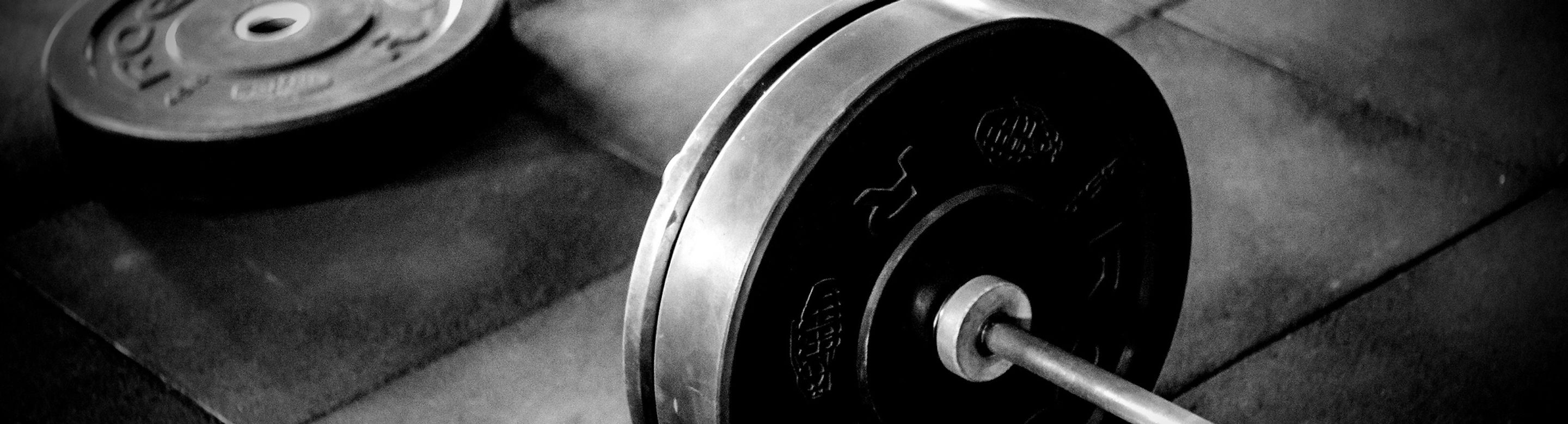 black%20barbell%20on%20tile%20flooring_edited.jpg